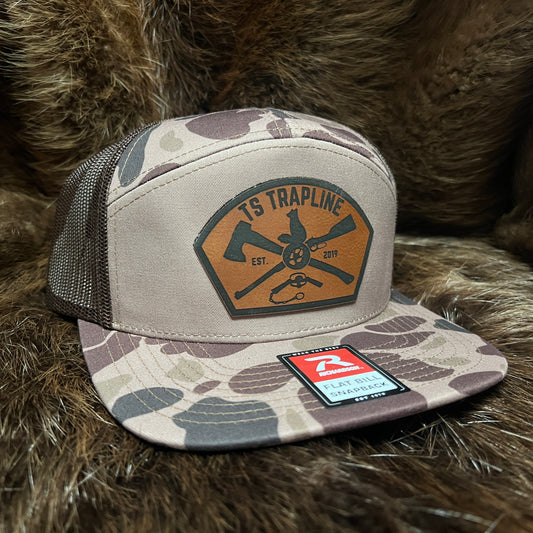 Richardson 7 Panel Camo Mesh Back Trucker w/ Ax & Rifle “Tombstone” Leather patch
