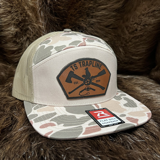 Richardson 7 Panel Camo Mesh Back Trucker w/ Ax & Rifle “Tombstone” Leather patch
