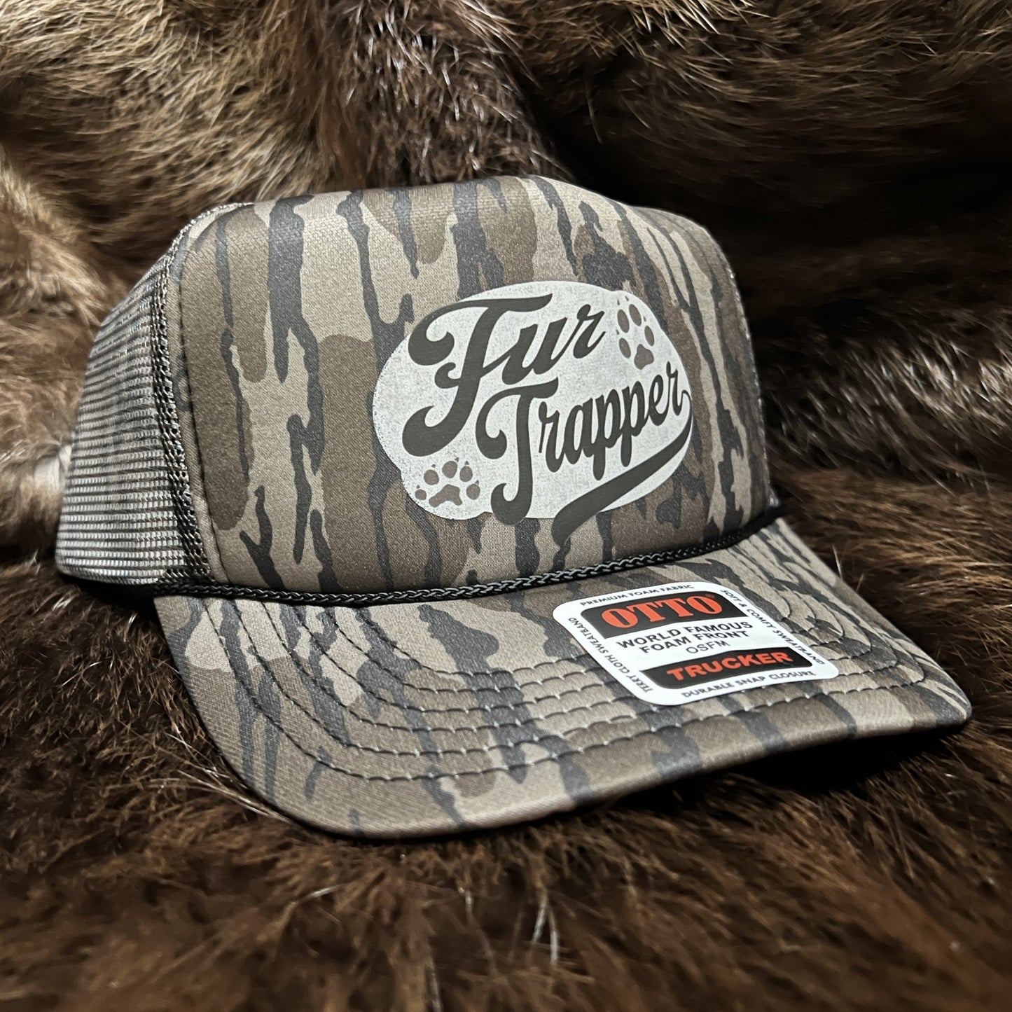 Bottomland Camo Trucker with Fur Trapper Logo
