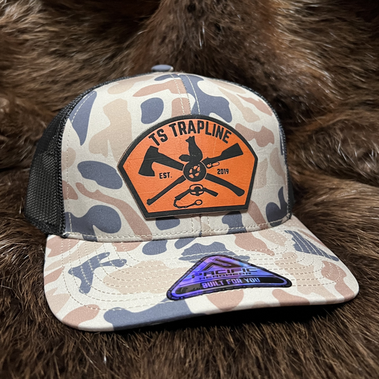 Retro Duck Camo Mesh Back Trucker w/ Orange Ax & Rifle “Tombstone” Leather patch