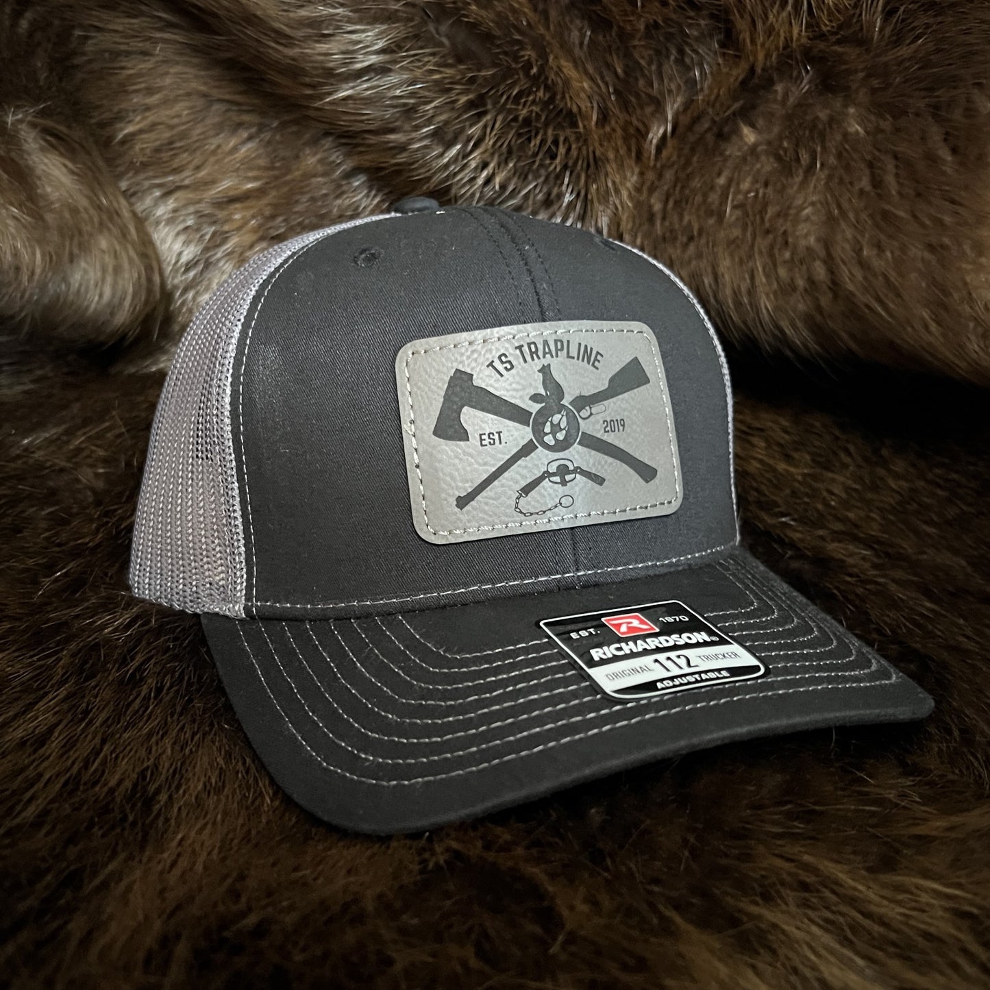Richardson 112 Mesh Back Trucker Hat w/ Gray Leather Ax & Rifle Logo Patch